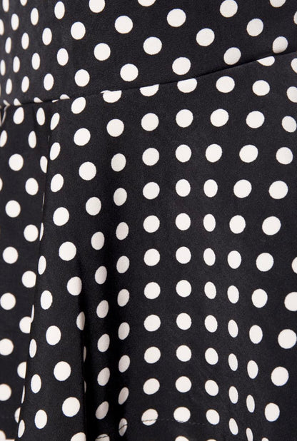 Vintage midi-length pencil skirt in black polka